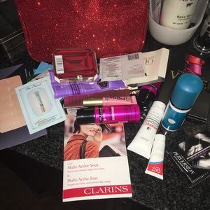 big red makeup bag full of samples